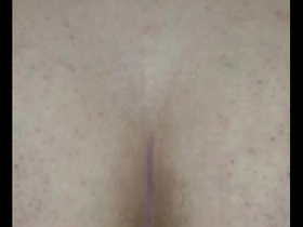 A gay man with an overweight body enjoys anal pleasure with a dildo.