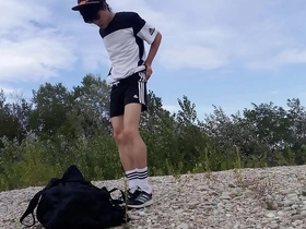 Young and straight twink Jon Arteen in black Adidas outfit, freeballing and jerking off outdoors.