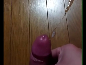 Leather-clad Japanese man masturbates and ejaculates before getting an erection.