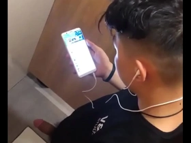 Asian stud flaunts his large cock in the bathroom