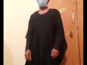A Pakistani gay man in a black abaya has sex and reaches an orgasm.
