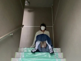 Mayu Konka shows off her pantyhose in a public staircase photo.