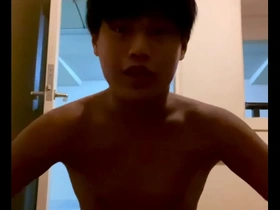 Naked in my apartment, pleasuring myself with a dildo.