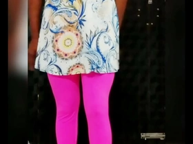 Beautiful shemale Crossdress 6 wears a bra and skirt.