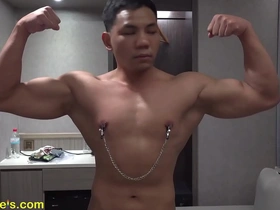 An Asian model with an incredible body has nipple clips on and likes to be adored.
